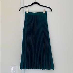 Green pleated skirt